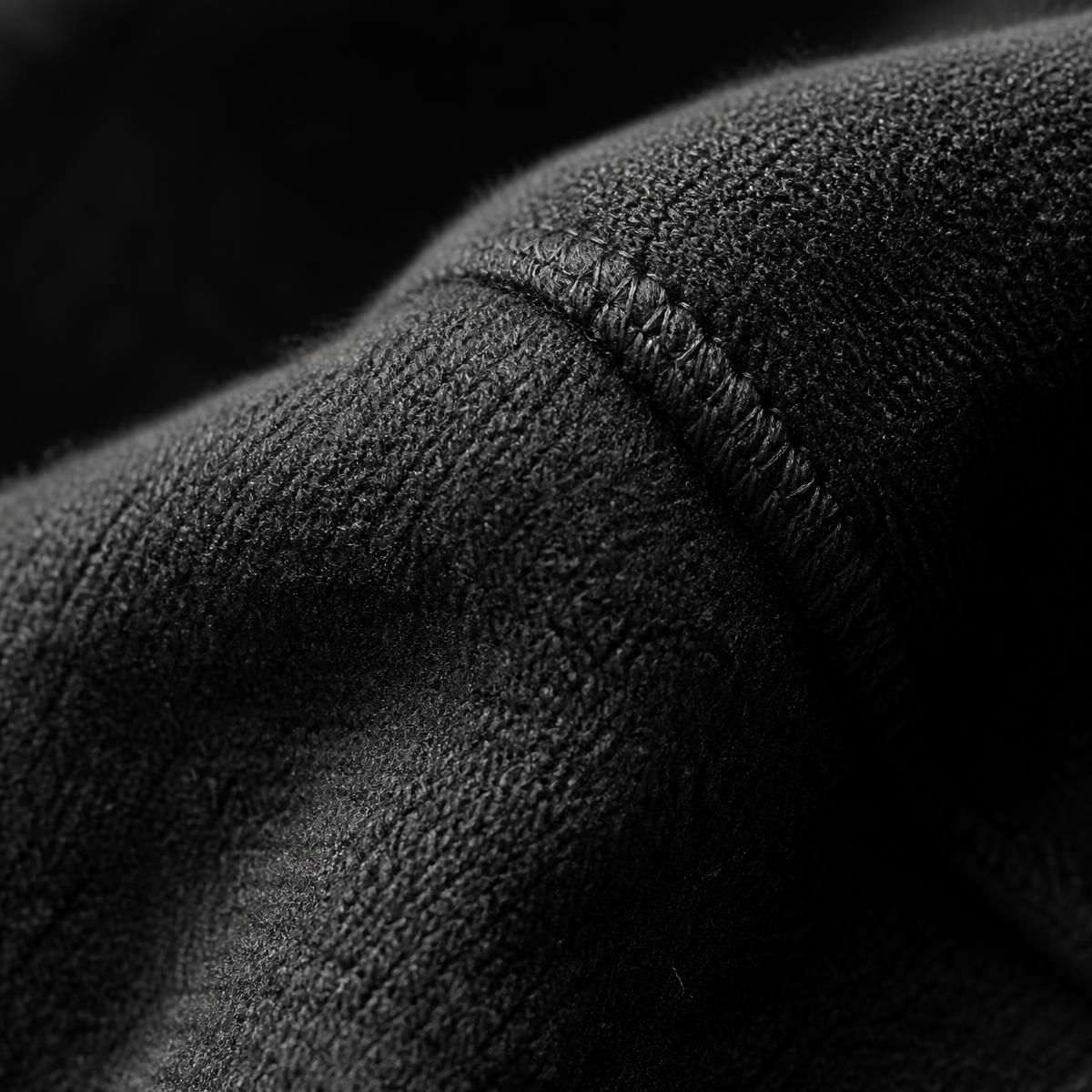 Macro detail of heavyweight black fleece and stitching